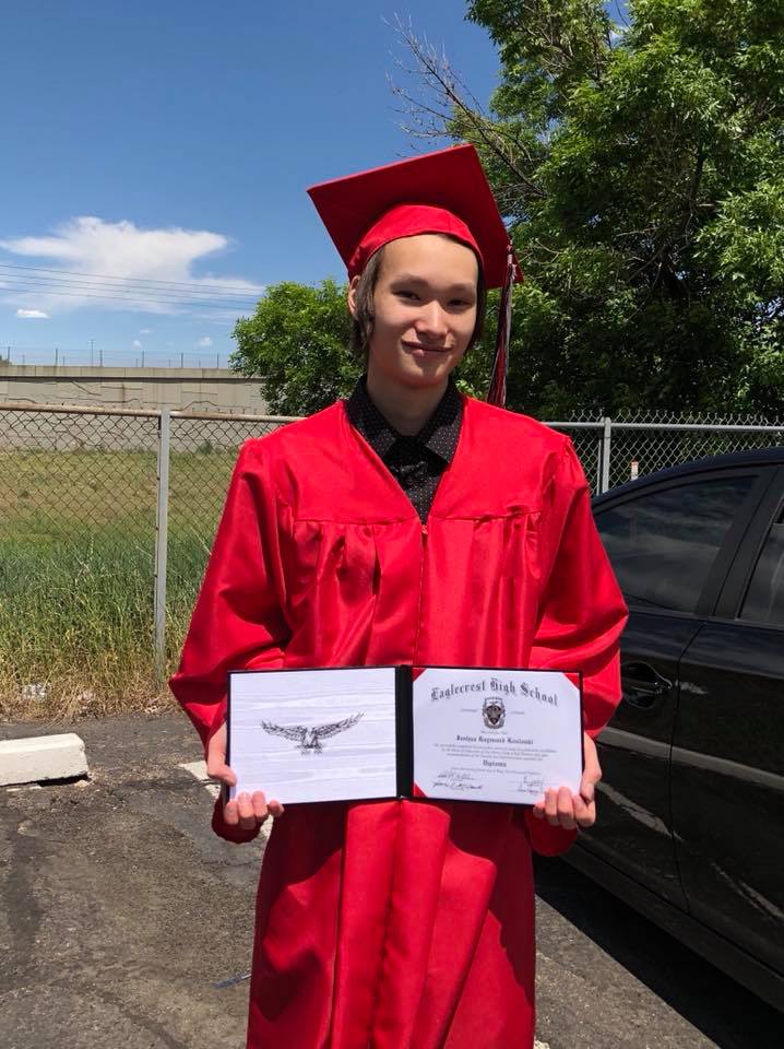 Joshua Kosloski in graduation cap and gown