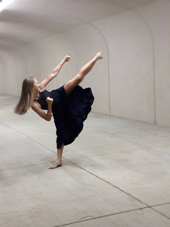 Mahayla Griggs kicking in a formal dress